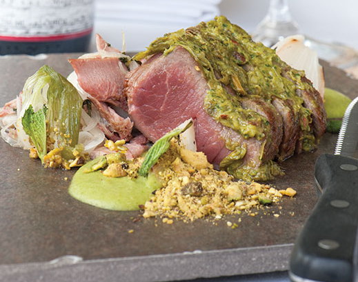 Grilled lamb with toasted farrotto, pistachio crust and creamy green garlic vinaigrette at the Frog & the Peach.
