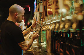 Bartender Brian Zuzulock mans the 24 taps at the Brickwall Tavern in Burlington City.