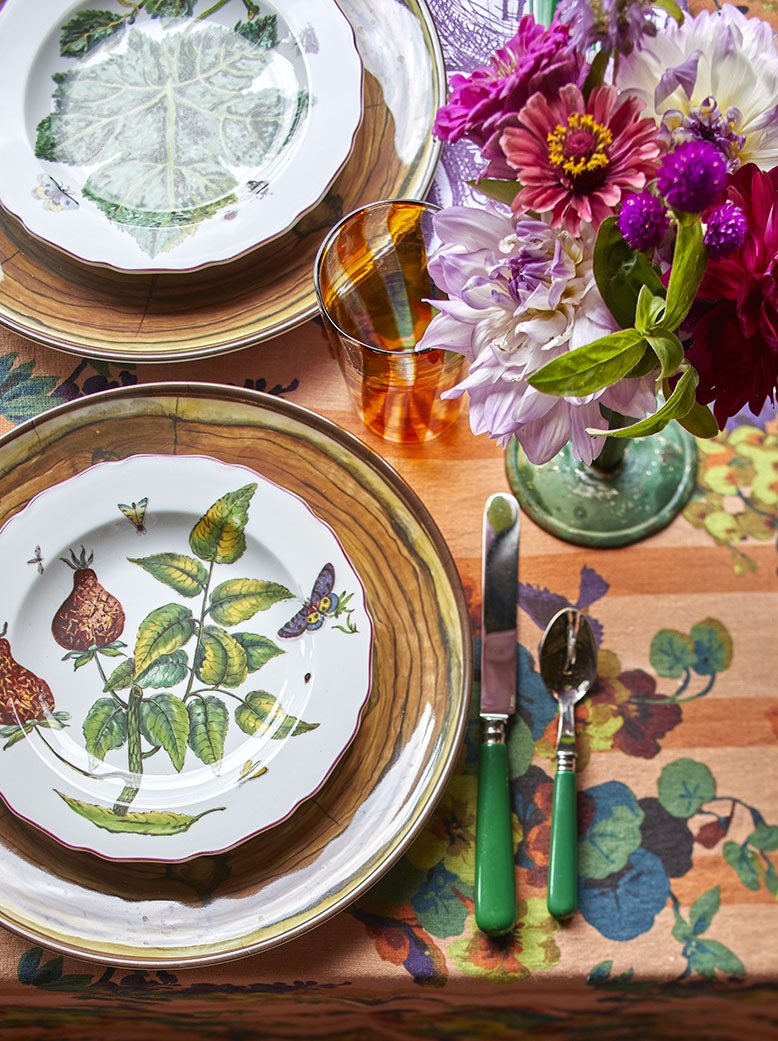 A colorful tablescape for lunch at Bird Haven Farm includes freshly picked flowers