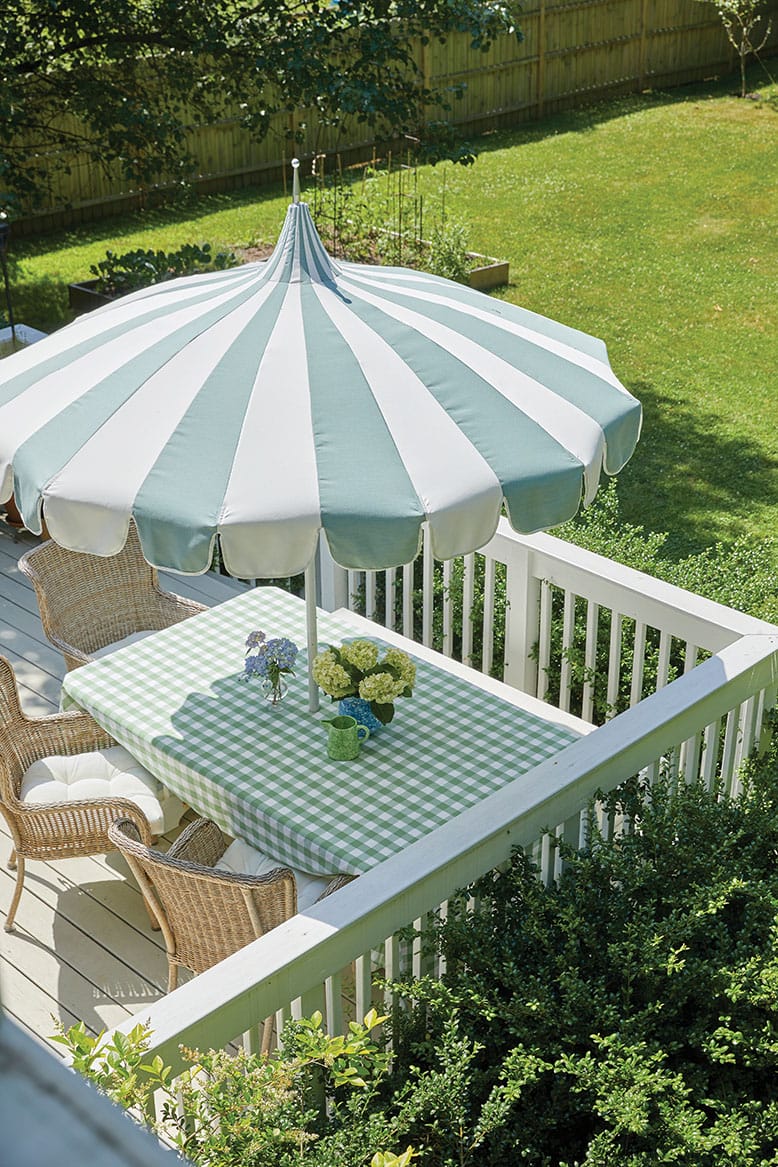 A jaunty striped pagoda umbrella in the backyard of a home in Farmingdale, New Jersey