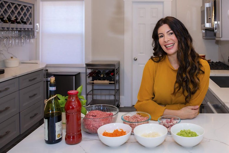 Barbara Morini in her Montclair kitchen, surrounded by ingredients for her pork and beef ragù