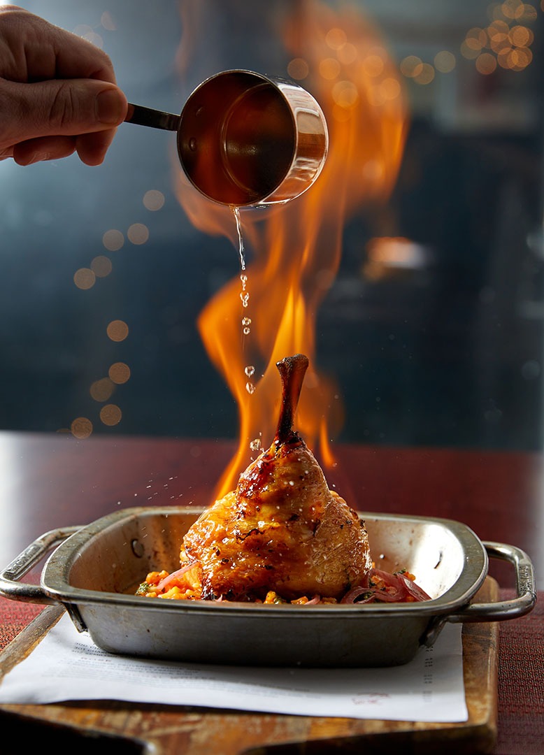Flaming chicken at the GOAT by David Burke in Union Beach
