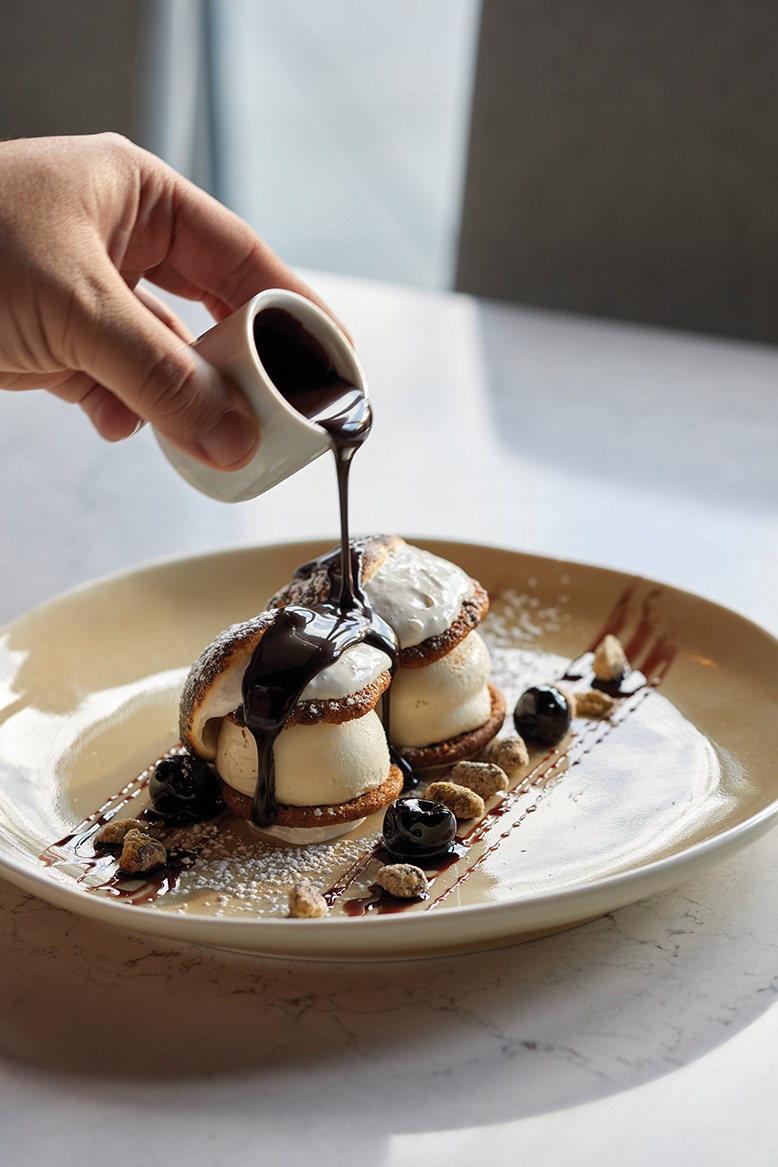 The ice cream sliders are topped with toasted marshmallow and chocolate sauce.