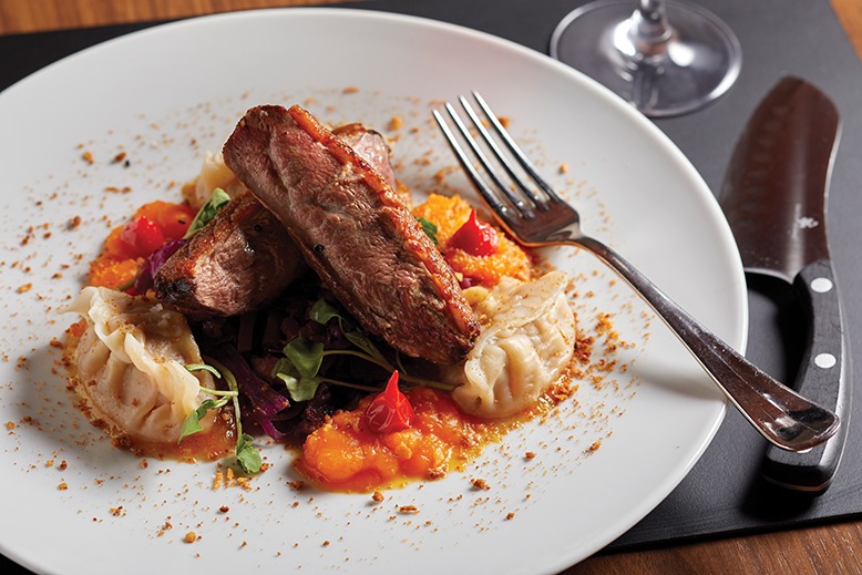 A plate of roast duck and foie gras dumplings at 1776 by David Burke in Morristown.