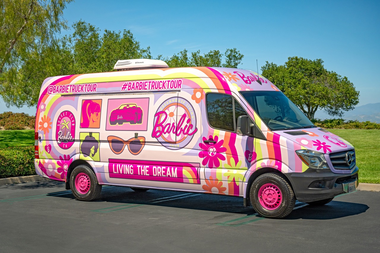Truck decked out in colorful Barbie logos