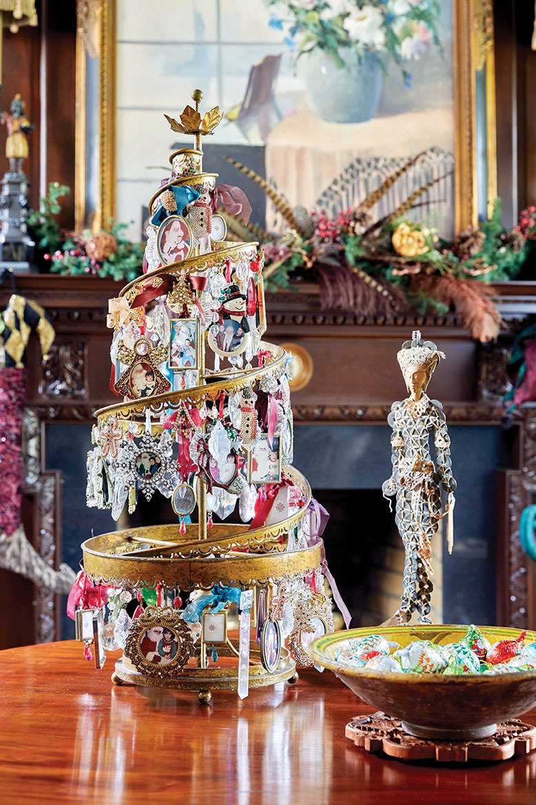 A mini Christmas tree loaded with vintage crystals and cherished holiday photos