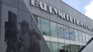 Exterior of Barrymore Film Center in Fort Lee showcasing mural of silent filmmakers