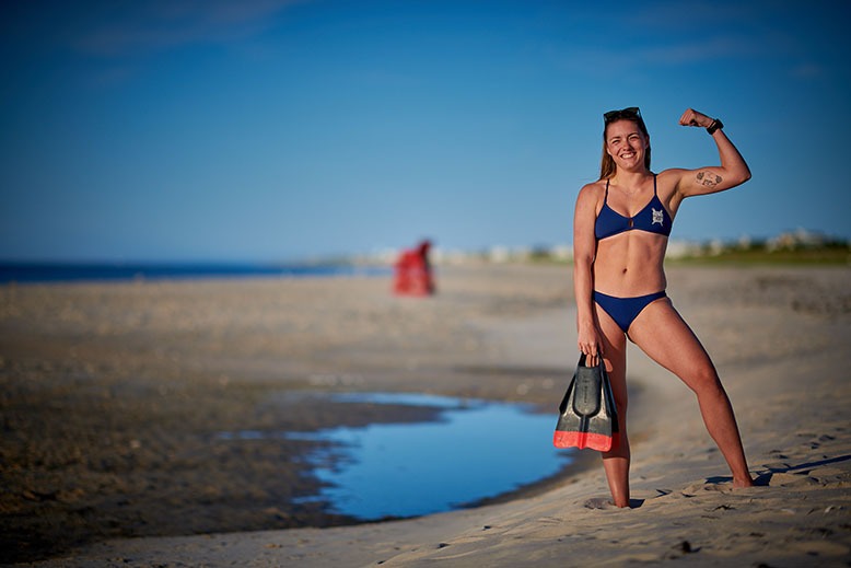 Laura Patterson flexes a muscle at Barnegat Light