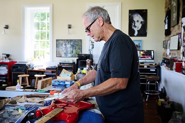 Luthier Curt Wilson inside his Hopewell studio, a former schoolhouse in Hopewell