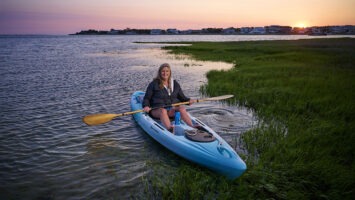 LBI’s Angela Andersen in a kayak in the bay at sunset