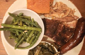 A platter of barbecue meats with fixings at South Valley BBQ in West Orange