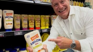 Michael Leffler holds a bottle of his mayo.