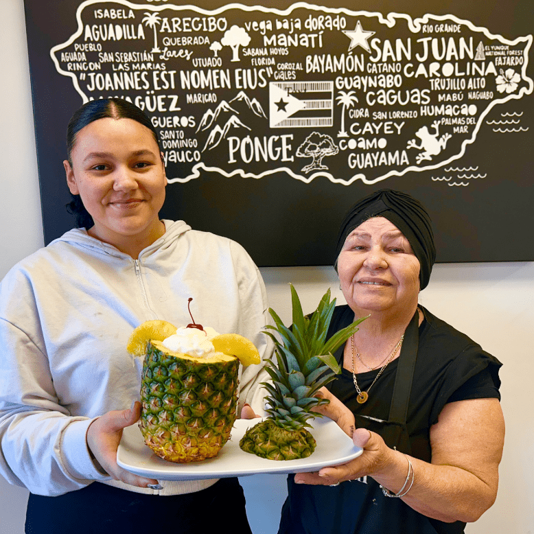 Zaire Vendrell and her abuela, Carmen, show off the piña colada at El Coquí Crepes in Denville