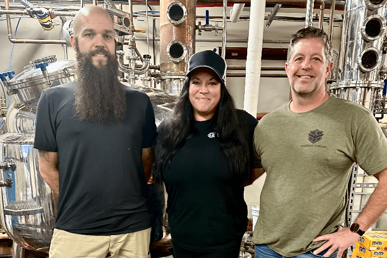 Brothers Gordon and Mike Geerhart with bartender Rayna Funari at Milk Street Distillery in Branchville
