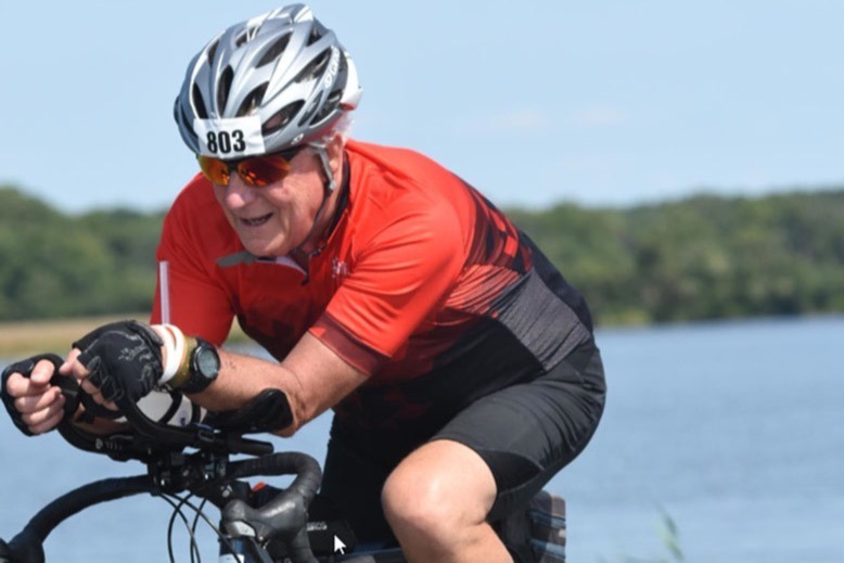 Donald Cooper on the bike portion of a competition