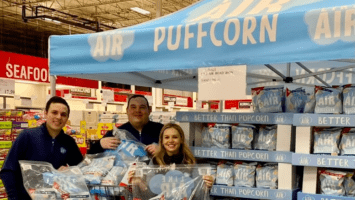 Siblings Kevin Atieh, Steve Atieh and Allison Lin in a grocery store with their product, Like Air Baked Puffcorn