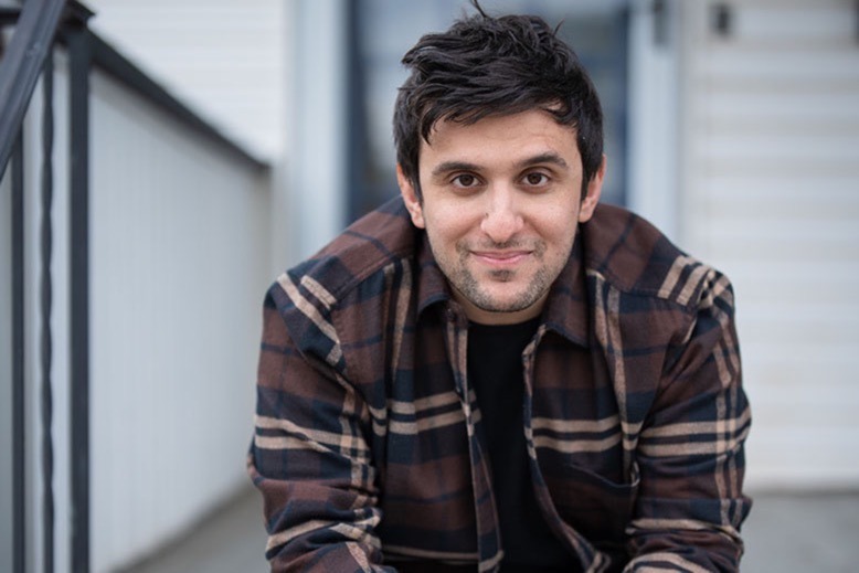 Joe Signorello sits on porch steps