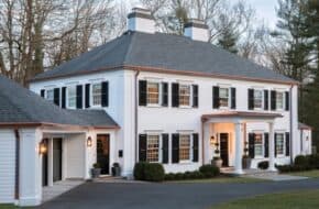 Princeton home with white siding, black shutters and copper accents