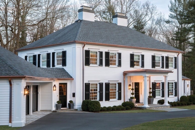 Princeton home with white siding, black shutters and copper accents