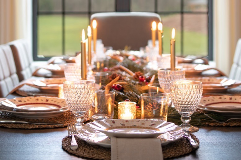 Cozy, candlelit tablescape in Kate Rumson's dining room
