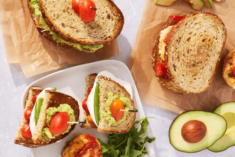 Assorted sandwiches featuring guacamole, tomatoes and avocado