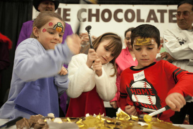Kids smash chocolate at Chocolate Expo in Edison
