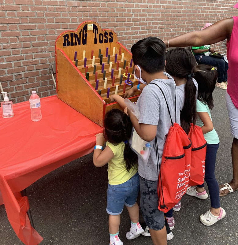 Children play a game of ring toss