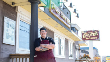 Beat Bobby Flay Champion, Chef Britt Rescigno, proudly waits outside Delaware Oyster House.