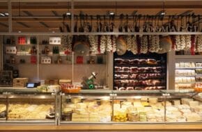 A counter at Eataly Short Hills featuring cheeses and meats