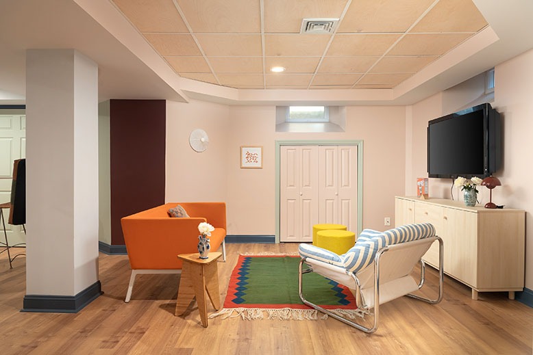 A Chatham basement feature colorful seating, organic materials and playful objects