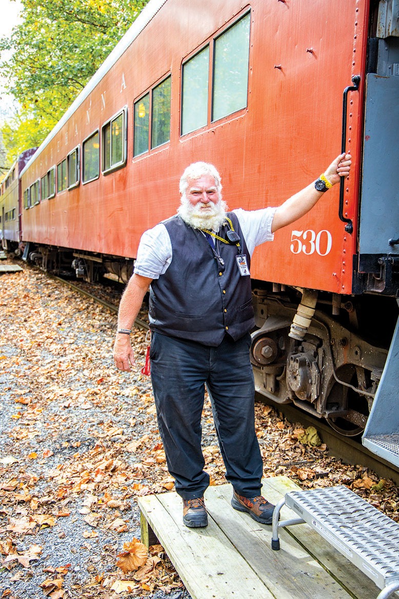 Conductor Chuck Hoering helms steam locomotive number 142, a historic passenger train in Phillipsburg