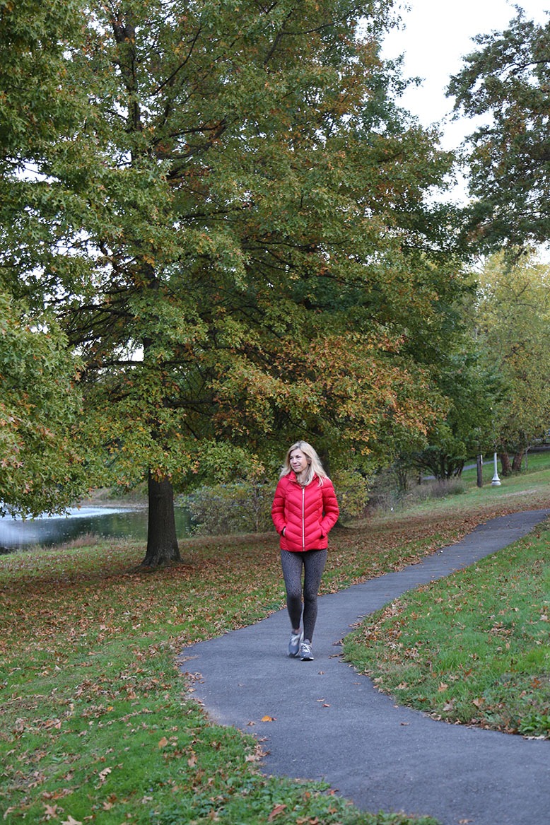 A woman walks in Yantacaw Brook Park in early fall