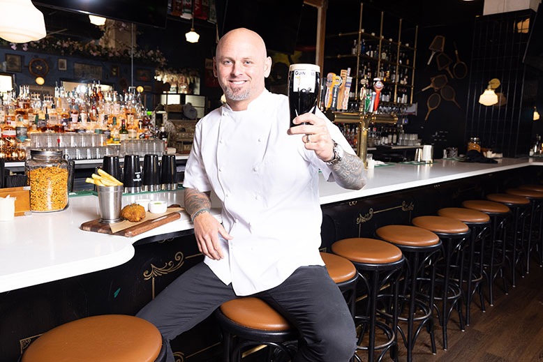Chef/owner James Avery raises a Guinness at his Black Swan Public House in Asbury Park