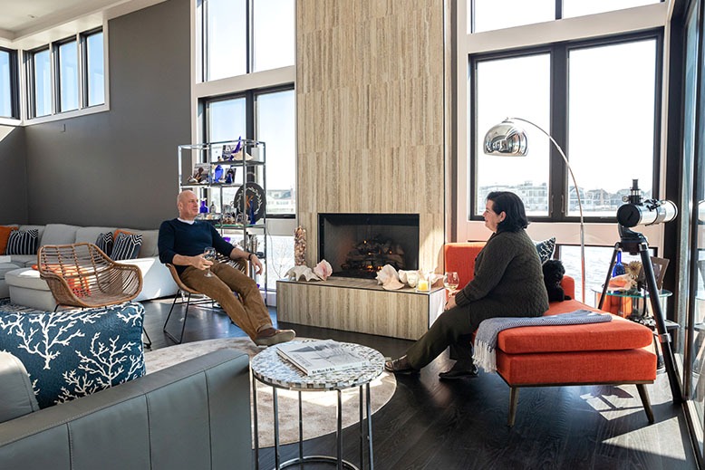 Stacey Ruhle Kliesch and Gary Kliesch relax in the living room of their waterfront LBI home