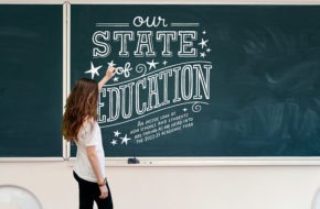 Girl writing on chalkboard