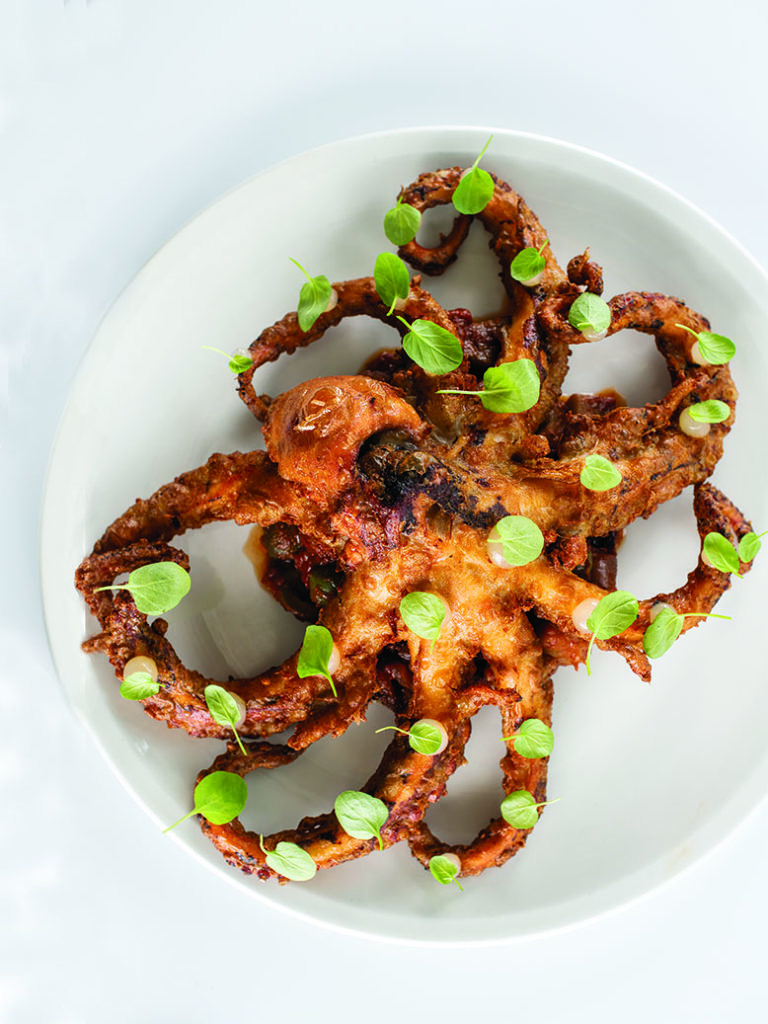 Fried octopus with cress leaves over eggplant puttanesca at Osteria Crescendo in Westwood