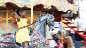 Young girl on carousel at Steel Pier in Atlantic City.