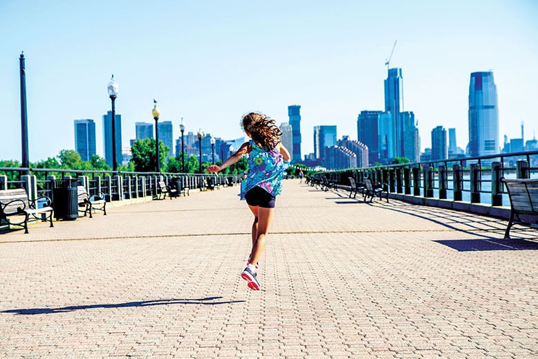 Young girl on walkway at Jersey City's Liberty State Park