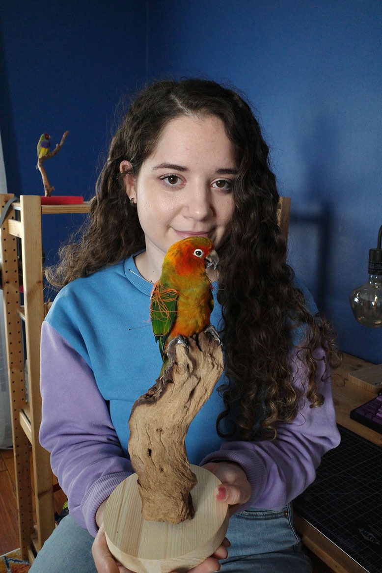 Nutley-based artist and taxidermist Jessica Drago poses with a taxidermied bird