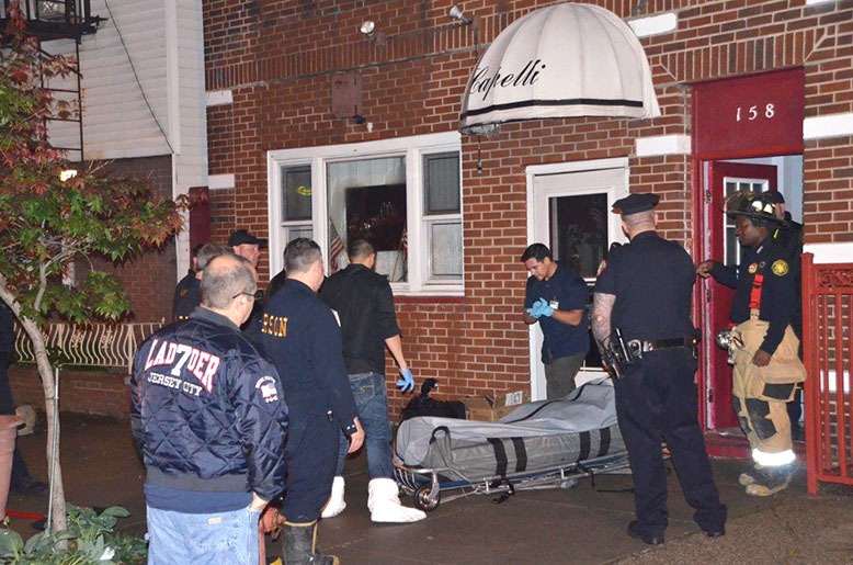 Investigators outside the apartment of Michael Galdieri in 2014