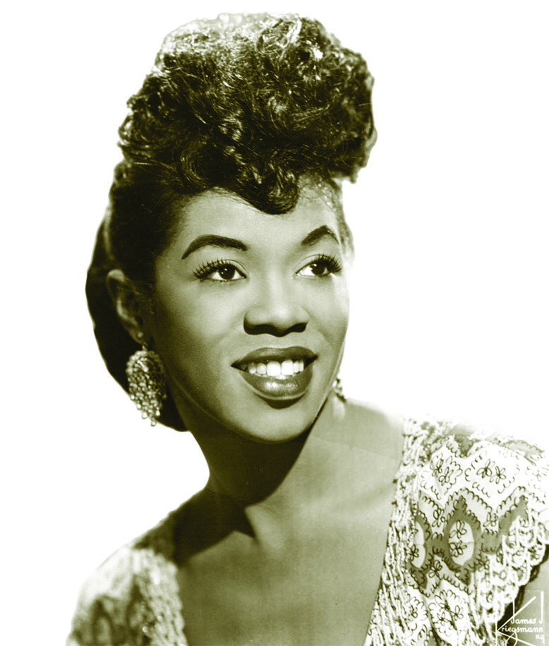 Black-and-white headshot of the late jazz singer Sarah Vaughan