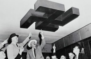 Sussex County sheriffs in a raid on Camp Nordland in Andover. They are shown examining a swastika decoration on the ceiling of one of the assembly halls at the camp in 1941. 