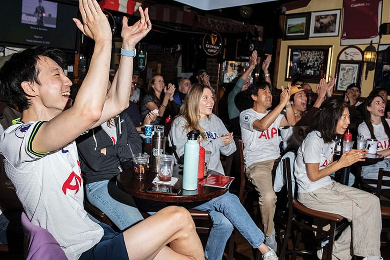 A spirited group of fans at Mulligan’s Pub in Hoboken take in a soccer match between Tottenham and Arsenal