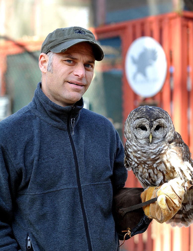 Chris Soucy, who runs the Raptor Trust in Millington, holds a barred owl