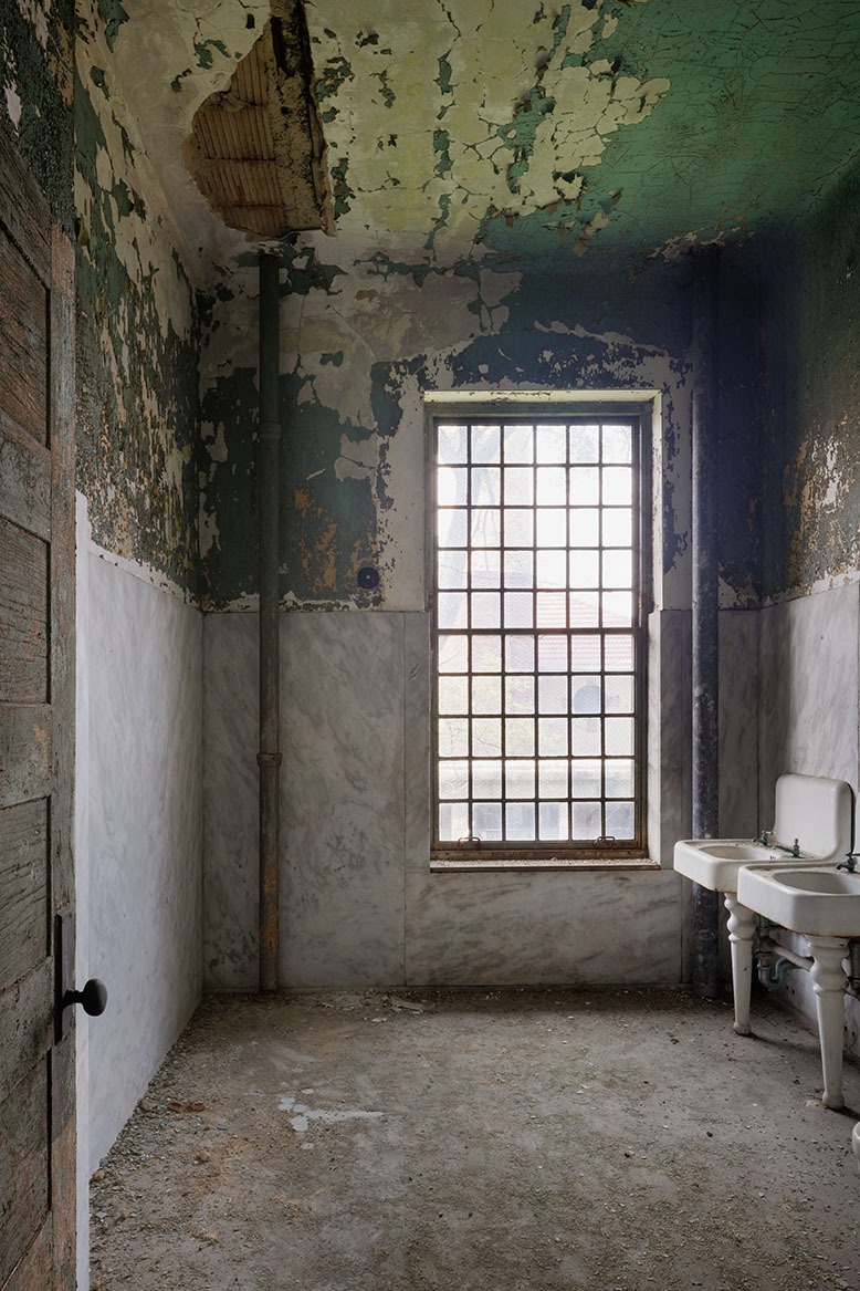A decaying room in Jersey's abandoned medical complex on Ellis Island has nothing but a window and two old sinks