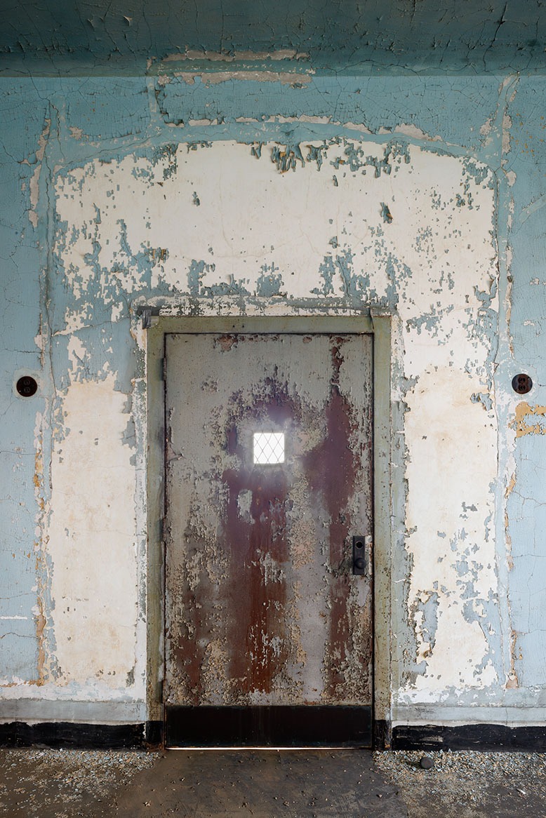 A decrepit door in the abandoned medical complex on Jersey's side of Ellis Island