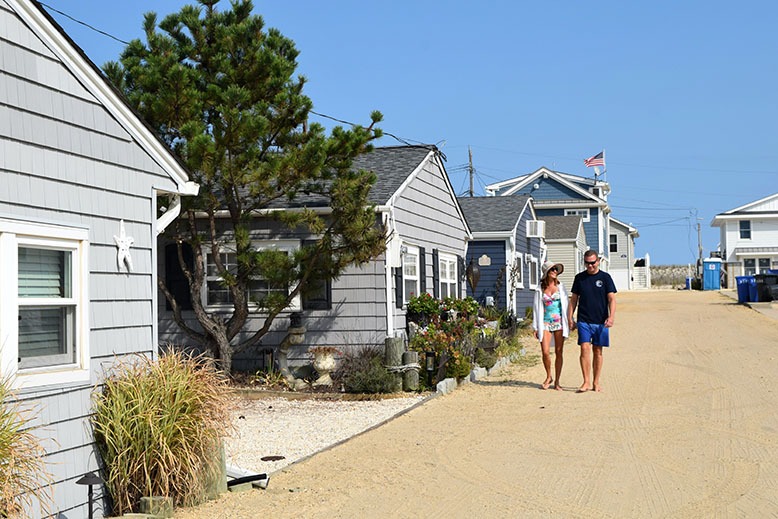 Kevin and Lisa Iredell walk the sandy streets of Ocean Beach II