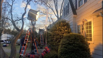 Film equipment and lighting outside a house in Montclair.