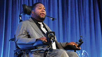 Eric LeGrand speaks at a 2022 event for the Christopher & Dana Reeve Foundation