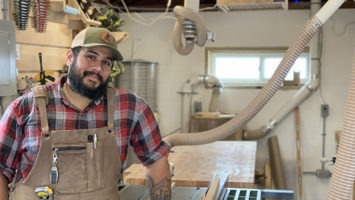 Woodworker Justin Bailey in his Rahway garage turned woodshop
